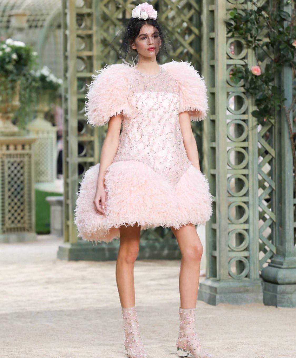 Model in a pink gown showcasing CHANEL’s haute couture collection